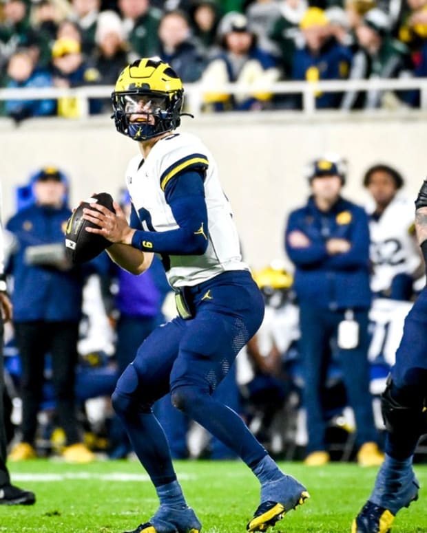 Michigan's J.J. McCarthy looks to throw against Michigan State during the second quarter on Saturday, Oct. 21, 2023, at Spartan Stadium in East Lansing.  